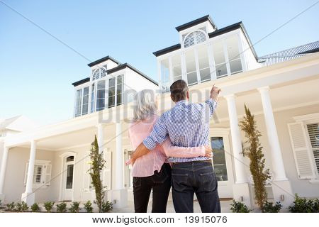Senior Couple Standing Outside Traumhaus