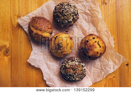 Homemade salty muffins also called proja pie traditional Balkans baked food with savory cheese ham eggs and paprika made of corn flour starch top view selective focus.