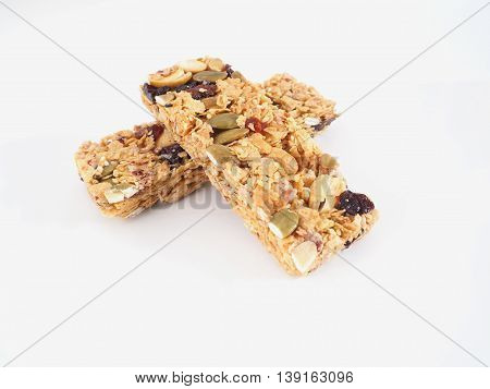 Healthy granola. Organic munchies bars on white background.