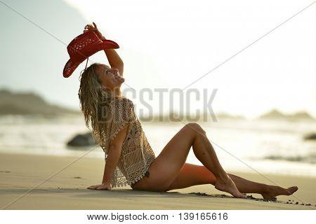 young woman relaxing on the beach in summer day
