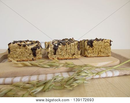 Vegan oatcake with carob frosting and oats