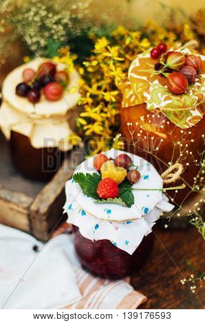 Homemade Strawberry Pits. Dessert Made Of Must And Flour Placed Inside Small Jars. Homemade Raspberr