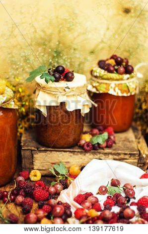 Homemade Strawberry Pits. Dessert Made Of Must And Flour Placed Inside Small Jars. Homemade Raspberr
