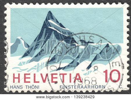 MOSCOW RUSSIA - CIRCA JANUARY 2016: a post stamp printed in SWITZERLAND shows Finsteraarhorn mountain the series 