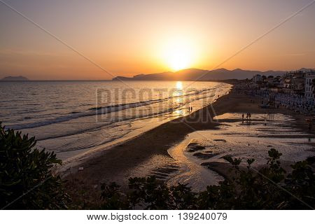 sunset on the beach of Sperlonga with the Circeo promontory in the background Italy