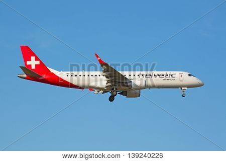 ZURICH - JULY 18: Helvetic airways landing in Zurich airport on July 18, 2015 in Zurich, Switzerland. Zurich airport is home port for Swiss Air and several budget airlines.