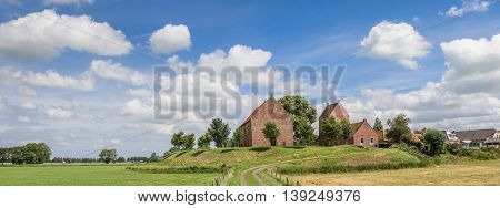 Panorama of medieval church of the Groningen village Ezinge in The Netherlands