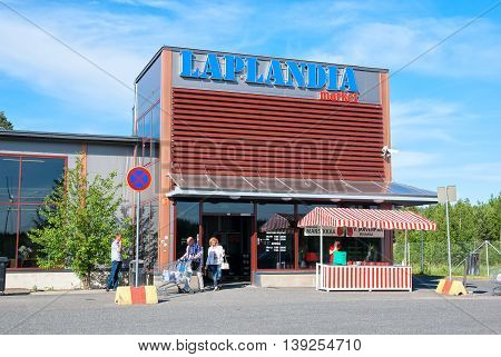 LAPPEENRANTA, FINLAND - JUNE 15, 2016: Laplandia Market near Finnish-Russian border. People drive shopping trolley with purchases to the car