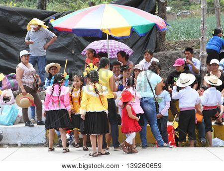 Magdalena Cajamarca Peru - July 17 2016: Members of dance troup wait with families to begin their traditional dance in Magdalena Cajamarca Peru on July 17 2016