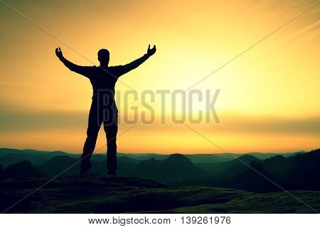 Happy Man With Open Raised Arms Gesture Of Triumph. Satisfy Hiker  Silhouette