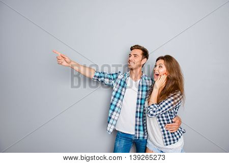 Young Man Showing Smth To His Shocked Girlfriend