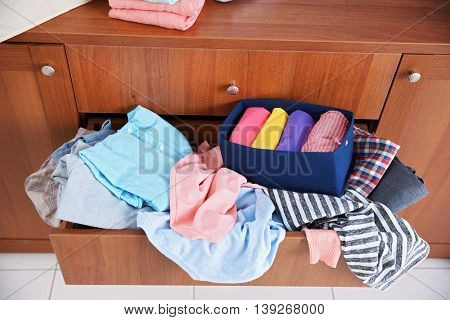 Pile of clothes in wooden drawer