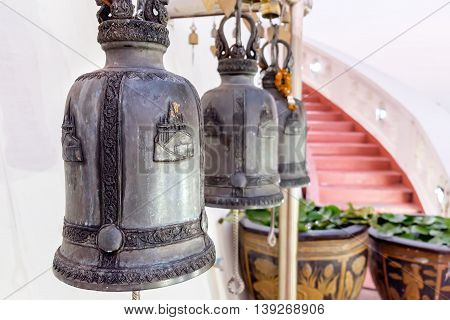 Row of Thai style bells in buddhist temple. Golden Mount temple Bangkok Thailand.