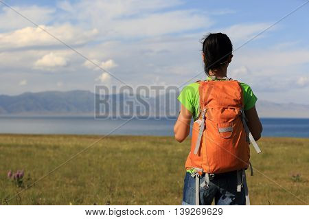 one young woman backpacker enjoy the view