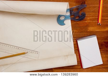 Roll of paper for drawings on a wooden table