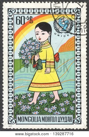 MOSCOW RUSSIA - CIRCA FEBRUARY 2016: a post stamp printed in MONGOLIA shows a happy child the series 