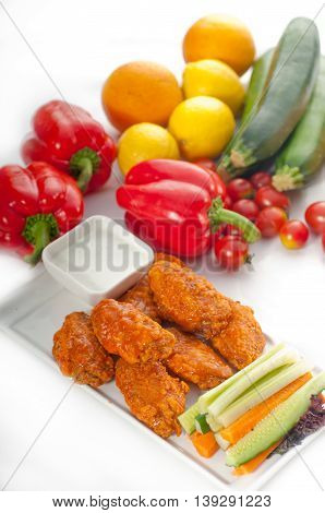 close up image of buffalo chicken wings served with pinzimonio