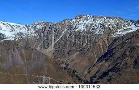 Mountainous terrain of mount Elbrus from Cheget. The November day, wind, cold and clear mountain air. Photo taken on: November 4 Monday, 2013
