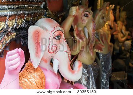KOLKATA WEST BENGAL INDIA - 13 SEPTEMBER 2015: Beautiful fresh painted clay idol of Lord Ganesha at Kumartuli as preparation for 