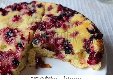 Beautiful cake with black currant, made from dough by hand at home