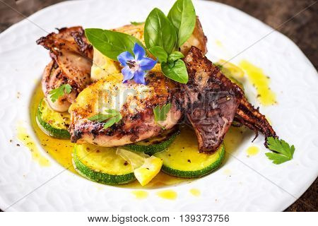 Grilled Squid With Lemon And Zucchini On Wooden Background