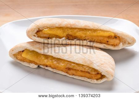 Tasty Fried Chicken Pita with Cheese on a White Plate