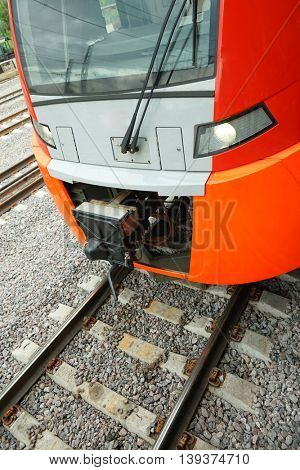ectric train on the railway. Vertical image.