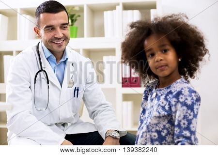 Pediatrician Looking To His Little Girl Patient