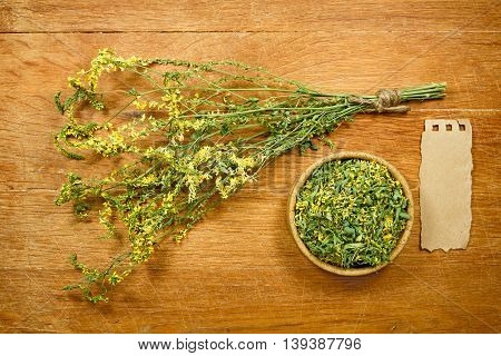 Melilot.Dried herbs for use in alternative medicine.Herbal medicine phytotherapy medicinal herbs.For preparation of infusions decoctions tinctures powders ointments tea.Background green cloth