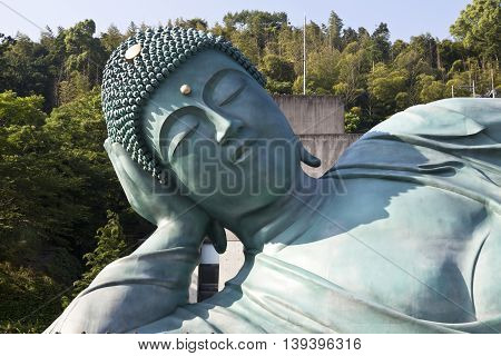 The bronze statue of reclining Buddha state at Nanzoin Temple in Sasaguri, Fukuoka, Japan.This is the bigest lying statue in the world.