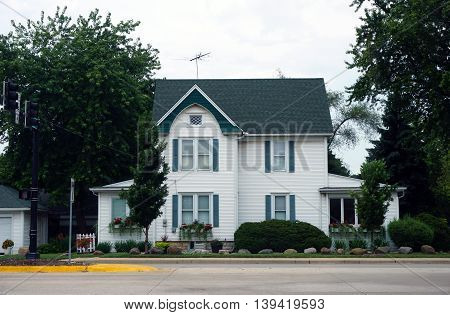 A large white home near downtown Plainfield, Illinois.