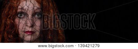 Woman wearing black veil on black background-Proportionate to Large Mobile Banner