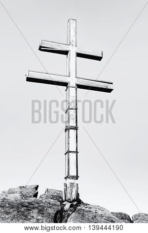Big cross on the hill Dumbier in Low Tatras mountains. Travelling theme. Black and white photo. Beautiful place. Symbolic object. Vertical composition.