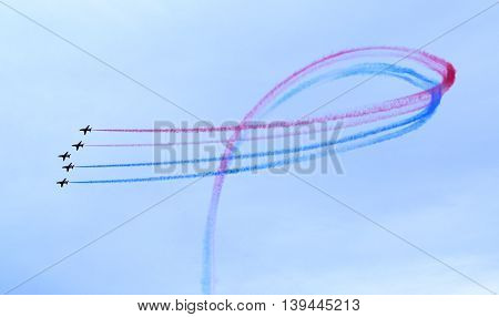 The Royal Air Force Red Arrows Display Team perform in Lyme Regis Dorset