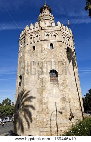 SEVILLE, SPAIN - September 13, 2015: The Torre del Oro (Tower of the Gold) is a dodecagonal military watchtower on September 13, 2015 in Seville, Spain