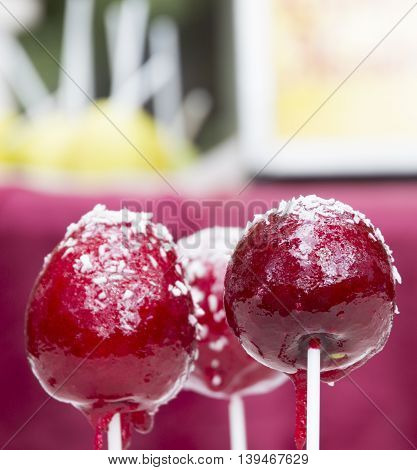 red apple in sugar on a stick