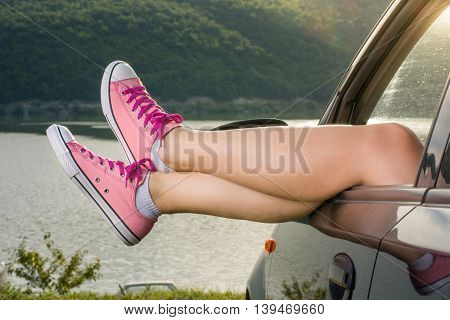 Legs Out Of The Car Window By The Lake