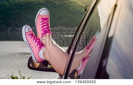 Legs Out Of The Car Window By The Lake