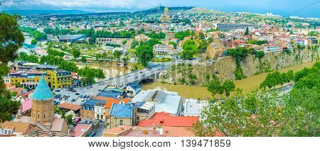 The winding Kura River surrounded the medieval quarters of Tbilisi Georgia.