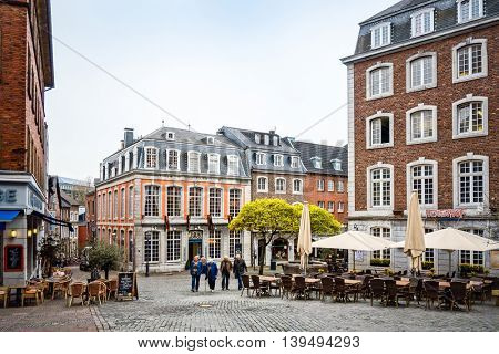 Aachen, Germany - April 13 : Tourists on foot Street in Aachen, Germany. Aachen was a residence of Charlemagne, and later the coronation place for German kings. April 13, 2016 in Aachen, Germany