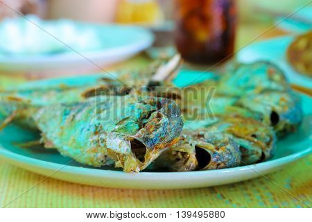 mackerel fish opens its mouth Oh My Gods after being fried.