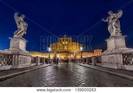 Night wide angle view of Castel Santangelo in Rome. Long exposure City lights