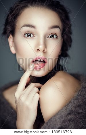 Fashion portrait of gorgeous young brunetee woman.Flirt expression. Shallow depth of field