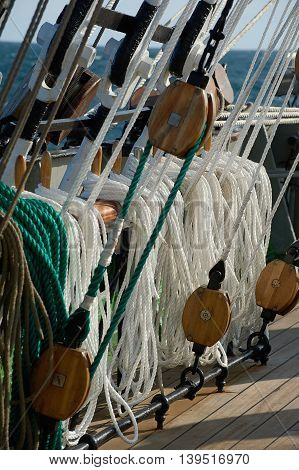 Rigging of a sailing ship, green and white ropes, blocks
