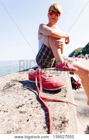 Girl Sunbathing On Wall.