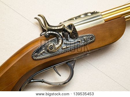 fragment of an old musket pistol flint lock mechanism of the eighteenth century. a copy of the pistol. souvenir
