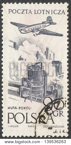 MOSCOW RUSSIA - JANUARY 2016: a post stamp printed in POLAND shows an airplane over a plant the series 