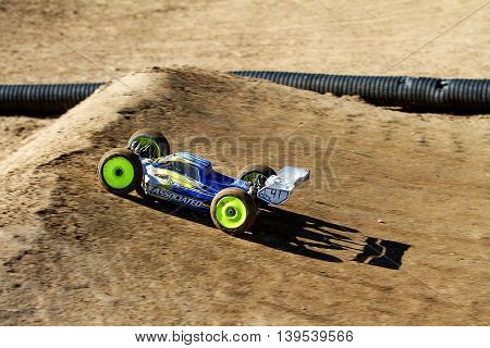BOISE IDAHO-JULY 16 2016: Team associated RC car getting ready to go through the air at the Boise Summer points race in Boise idaho