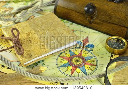 Diary with sea rope,compas and map, adventure concept