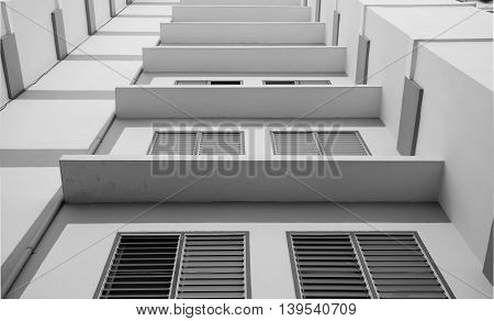 Look up at apartment housing in Thailand. Step of building.